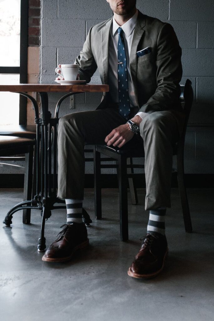 photo of man sitting on chair