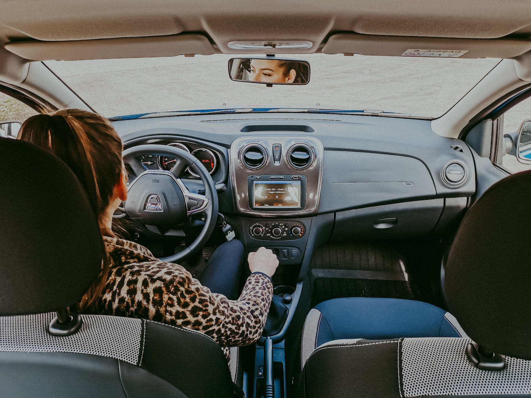 woman driving modern car along