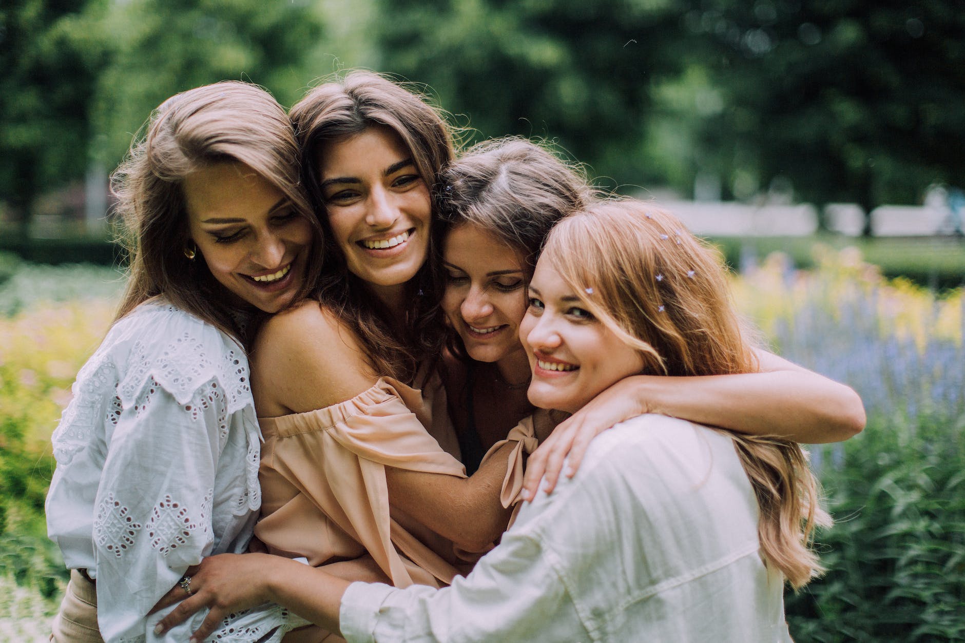 women hugging and smiling