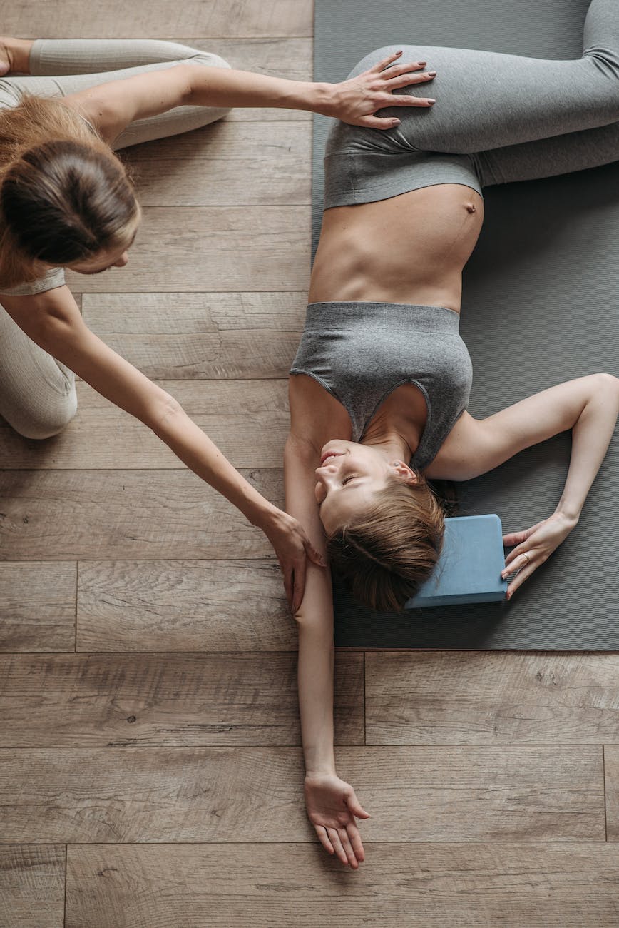 a pregnant woman lying on floor